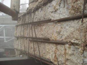 What steps are needed to prepare existing concrete for using FRP? What about cases where the rebar has corroded due to water infiltration and some of the surface concrete has popped off?