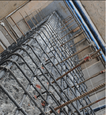 What is the life cycle of concrete structures that have embedded steel?